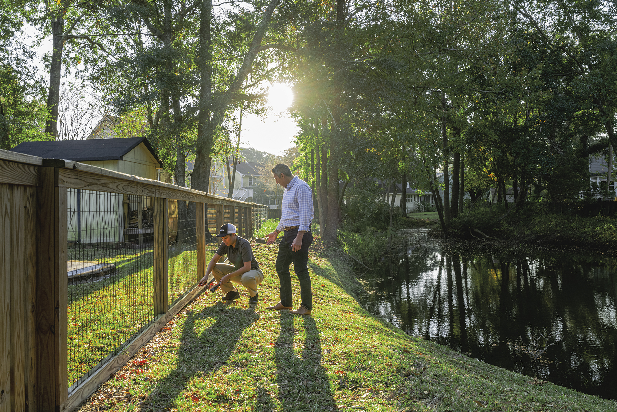 Roberts Pest Control technician consulting with homeowner during Sentricon installation in Jefferson County MO