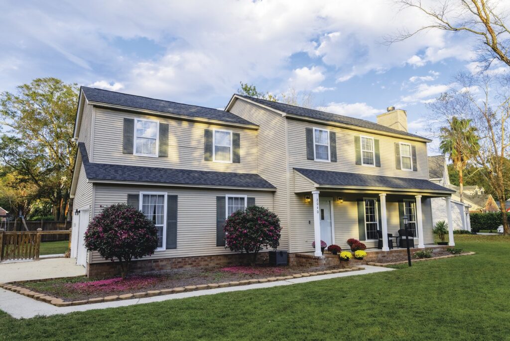 Brick two-story family home protected by the Sentricon termite colony elimination system